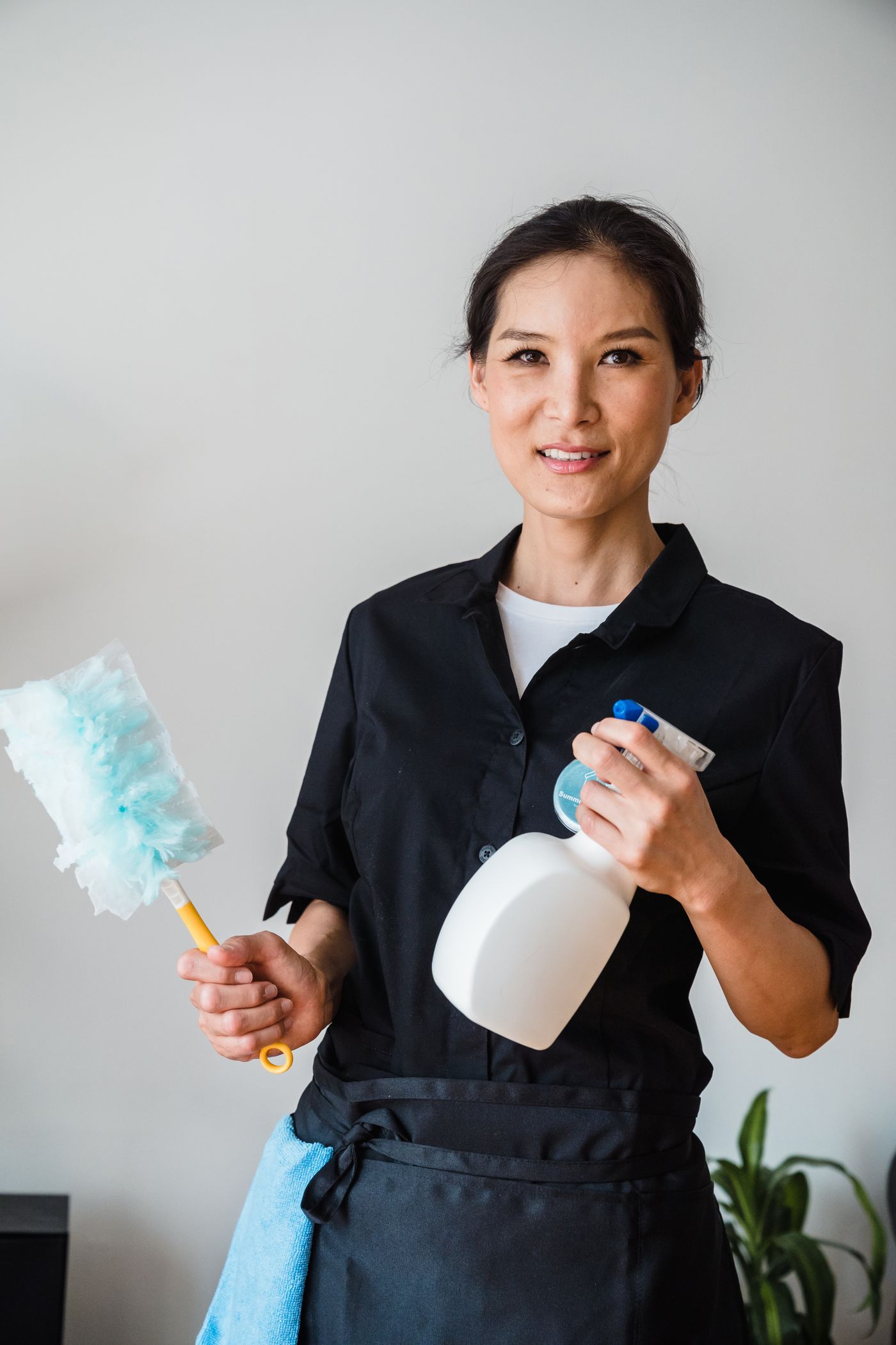 A friendly Superb Maids professional cleaner ready for the job